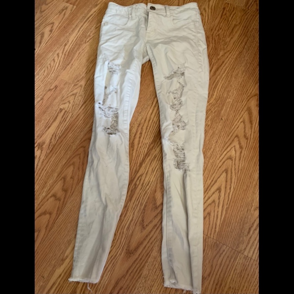 White ripped jeans. American eagle